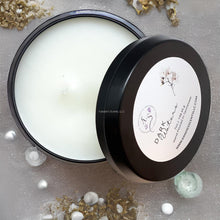 Load image into Gallery viewer, Matte black travel tin candle with ocean-inspired musk scent