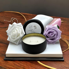 Load image into Gallery viewer, Matte black soy candle tin with clean laundry fragrance