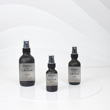 Load image into Gallery viewer, Ember Woods room spray bottles with citrus and earthy notes
