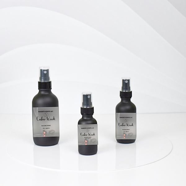 Ember Woods room spray bottles with citrus and earthy notes