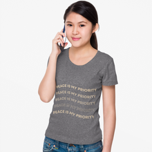 Load image into Gallery viewer, Woman wearing a gray t-shirt with 'Peace is my priority' text on a white background
