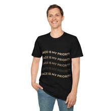 Load image into Gallery viewer, Person wearing a black t-shirt with 'Peace is my Priority' on a white background
