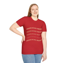 Load image into Gallery viewer, Person wearing a red t-shirt with 'Peace is my priority' text on a white background
