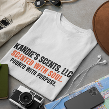 Load image into Gallery viewer, White t-shirt with text on a table with accessories
