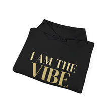 Load image into Gallery viewer, Black hoodie with 'I AM THE VIBE' text in gold on a white background
