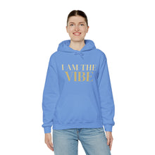 Load image into Gallery viewer, Person wearing a blue hoodie with 'I AM THE VIBE' text on a white background
