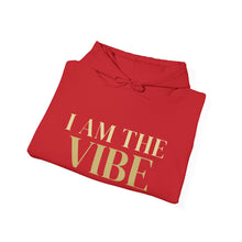 Load image into Gallery viewer, Folded red hoodie with 'I AM THE VIBE' text on a white background
