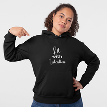 Load image into Gallery viewer, Person wearing a black hoodie with 'Lit with Intention' text on a plain background
