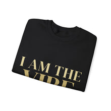 Load image into Gallery viewer, Folded black sweatshirt with 'I AM THE VIBE' text in gold on a white background
