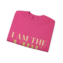 Load image into Gallery viewer, Folded pink sweatshirt with 'I AM THE VIBE' text in gold on a white background
