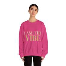Load image into Gallery viewer, Person wearing a pink sweatshirt with 'I AM THE VIBE' text on a white background
