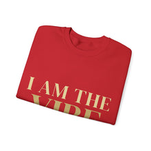 Load image into Gallery viewer, Folded red shirt with 'I AM THE VIBE' text in gold on a white background
