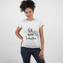 Load image into Gallery viewer, Woman wearing a white t-shirt with 'Lit with Intention' text on a plain background
