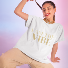 Load image into Gallery viewer, Woman wearing a white t-shirt with 'I AM THE VIBE' text on a gradient background
