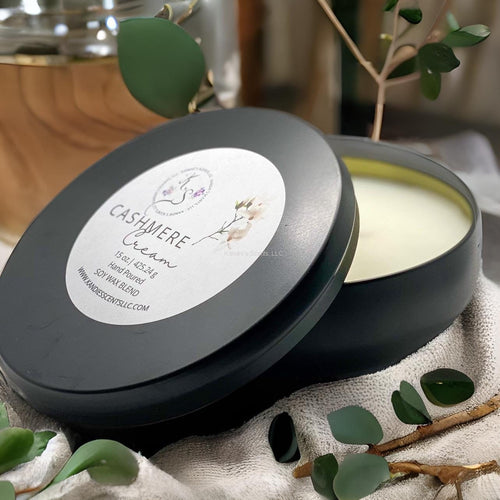 Luxury black tin candle with warm amber and musk notes